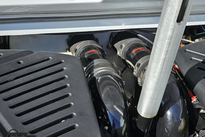 Slide: The Image of 2004 Baja 29 Outlaw engine compartment with dual exhaust system. - 84