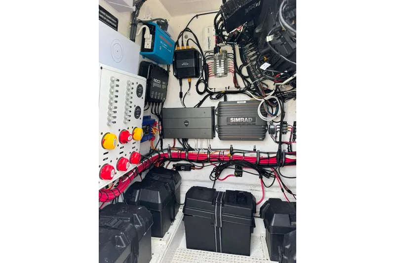Slide: The Image of 2019 Onslow Bay 33 Tournament boat electrical system with control panel and wiring. - 23