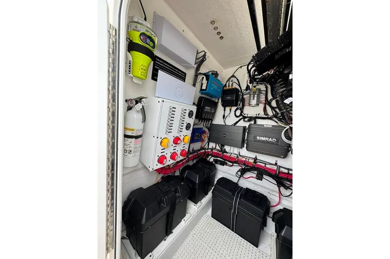 Slide: The Image of 2019 Onslow Bay 33 Tournament boat electrical system with control panel and wiring. - 24