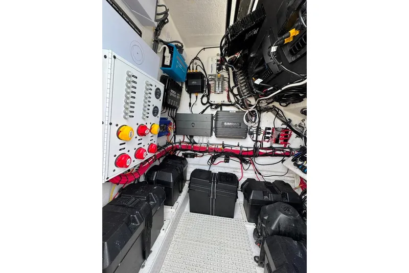 Slide: The Image of Electrical system of a 2019 Onslow Bay 33 Tournament boat, featuring organized wiring and components. - 25