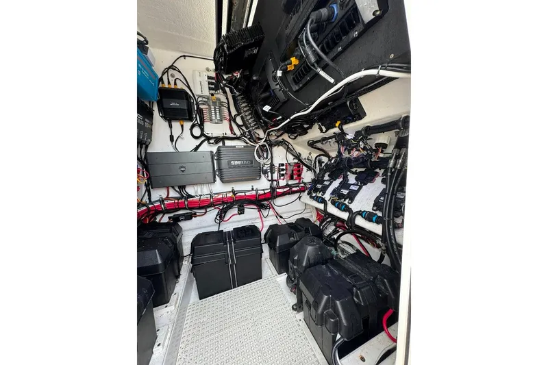 Slide: The Image of 2019 Onslow Bay 33 Tournament boat dashboard with steering wheel and navigation displays. - 26