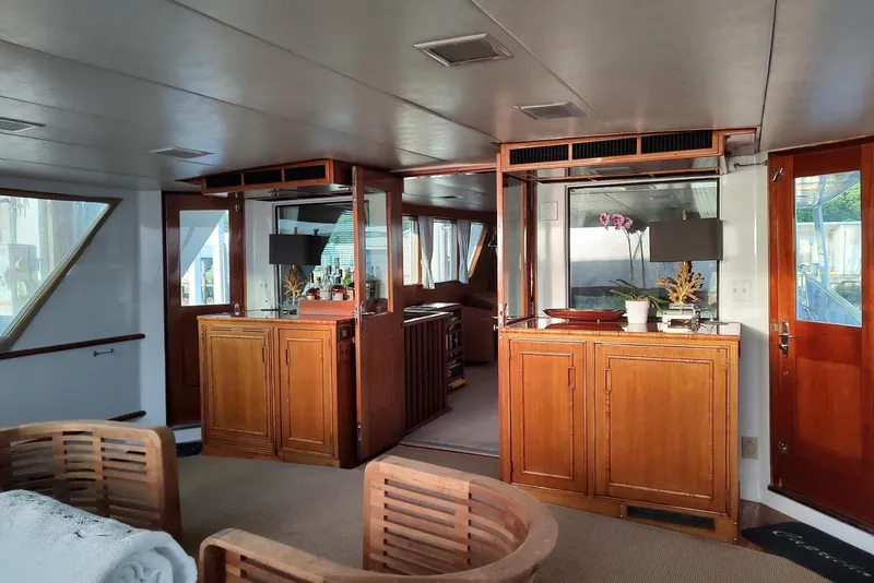 Slide: The Image of Luxurious 1987 Burger Motoryacht interior with elegant wood cabinetry and modern decor. - 11
