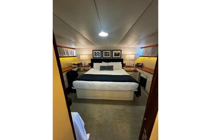Slide: The Image of Luxurious bedroom interior of 1987 Burger Motoryacht with cozy bed and elegant decor. - 18