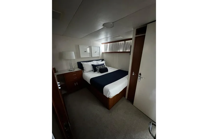 Slide: The Image of Cozy bedroom in 1987 Burger Motoryacht with elegant decor and natural light. - 20