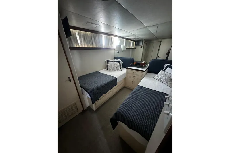 Slide: The Image of Twin cabin interior of 1987 Burger Motoryacht with cozy beds and elegant decor. - 21