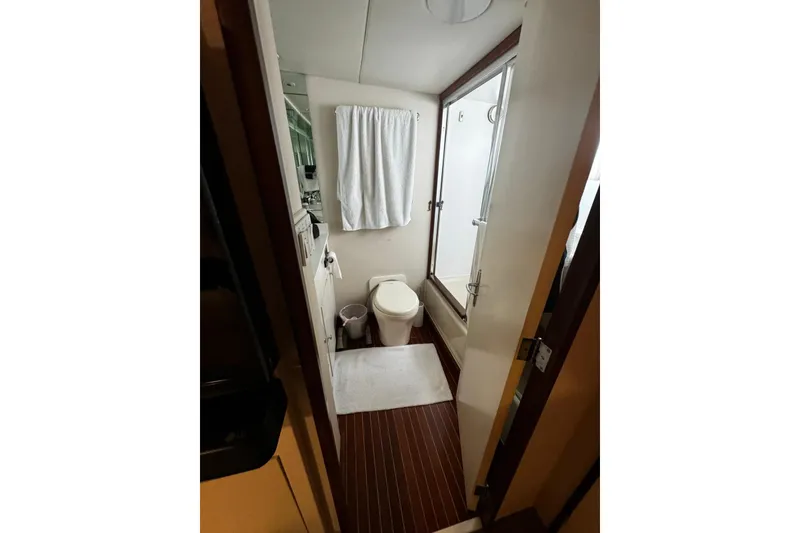 Slide: The Image of Bathroom interior of a 1987 Burger Motoryacht with shower and toilet. - 24