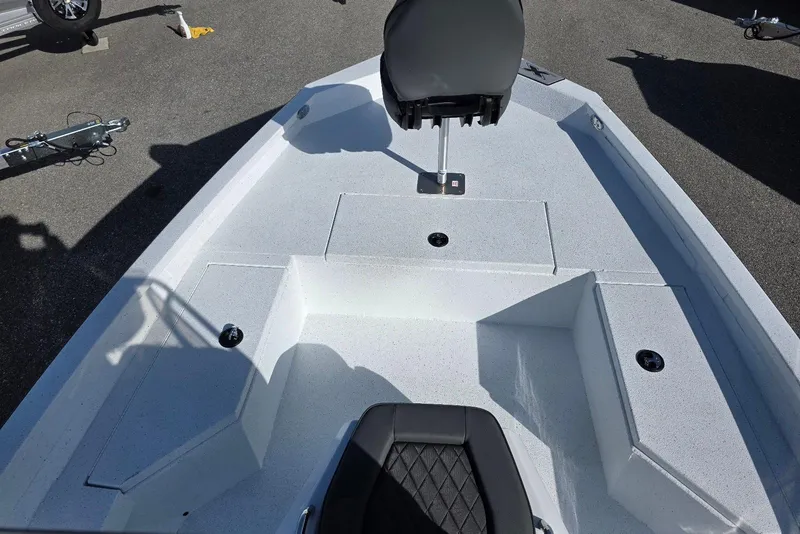 Slide: The Image of 2026 Xpress H20B Bay boat interior with seating and storage compartments. - 13