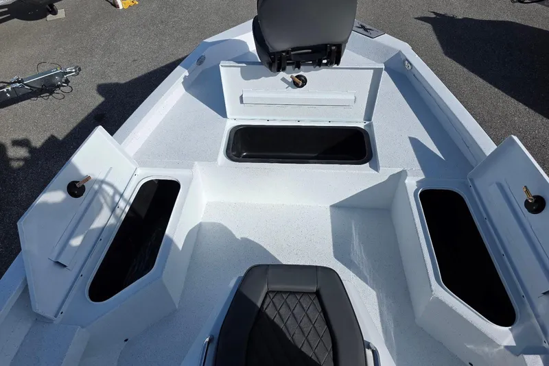 Slide: The Image of 2026 Xpress H20B Bay boat interior with open storage compartments and seating. - 14