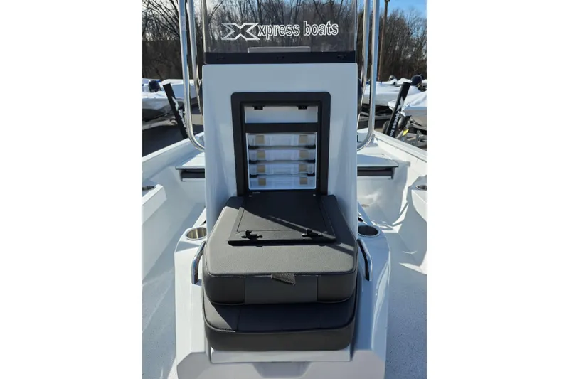 Slide: The Image of 2026 Xpress H20B Bay boat console with storage compartments and seating. - 19