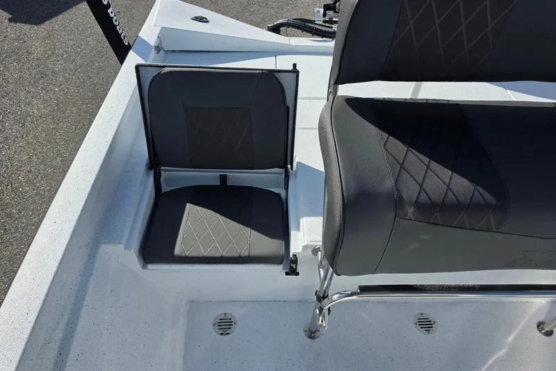 Slide: The Image of 2026 Xpress H20B Bay boat seating with diamond-stitched upholstery, showcasing modern design. - 24