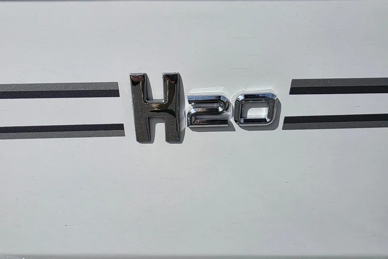 Slide: The Image of 2026 Xpress H20B Bay logo on a white surface with black stripes. - 8