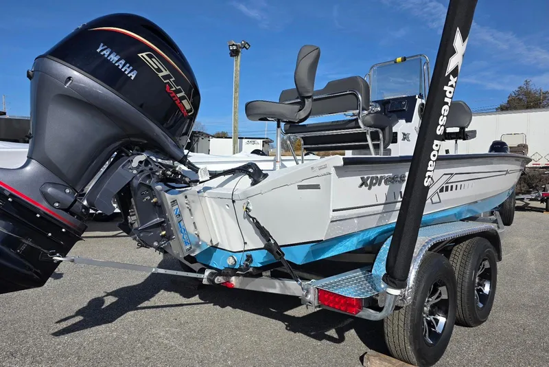 Slide: The Image of 2026 Xpress H20B Bay boat with Yamaha engine on a trailer. - 9