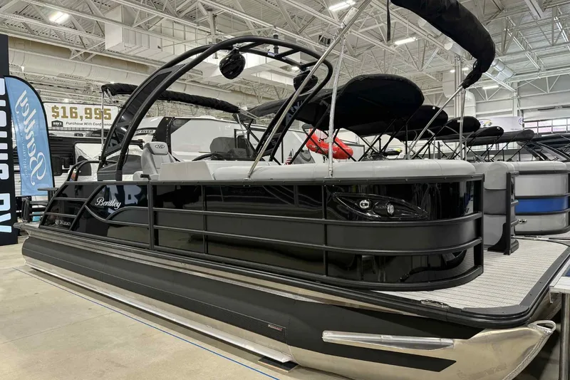 The Image of 2026 Bentley Pontoons Legacy 243 Swingback Dual Captain Full Tube Tower on display indoors. - 0