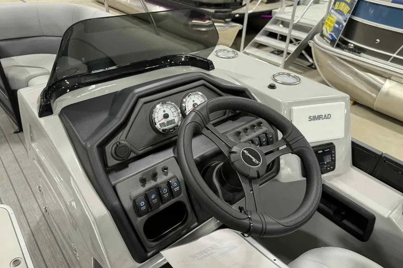 Slide: The Image of 2026 Bentley Pontoons Legacy 243 dashboard with steering wheel and control panel. - 15