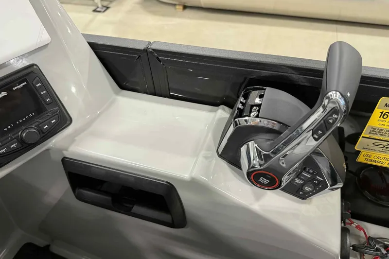 Slide: The Image of Control panel of 2026 Bentley Pontoons Legacy 243 with throttle and audio system. - 18