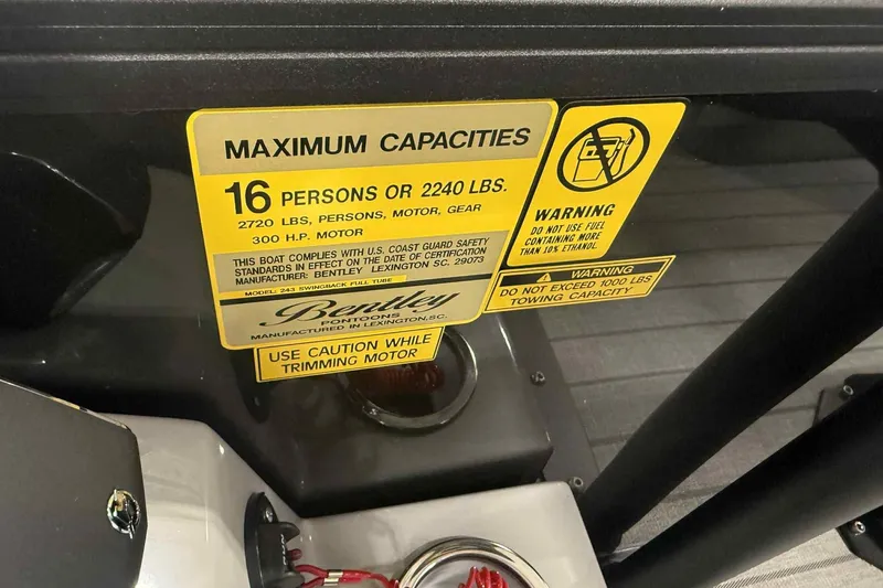 Slide: The Image of 2026 Bentley Pontoons Legacy 243 capacity label, 16 persons or 2240 lbs, safety warnings. - 19