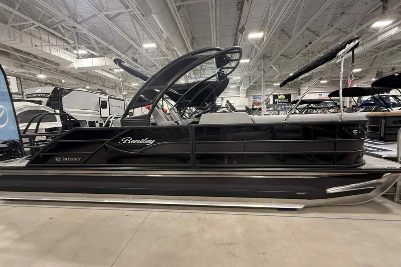 Slide: The Image of 2026 Bentley Pontoons Legacy 243 Swingback Dual Captain Full Tube Tower in showroom. - 2