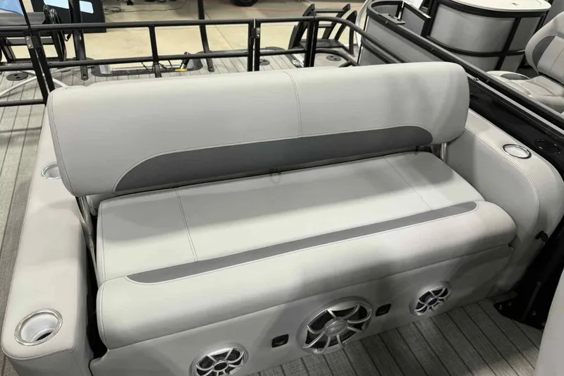 Slide: The Image of 2026 Bentley Pontoons Legacy 243 Swingback seating with integrated speakers and cup holders. - 21