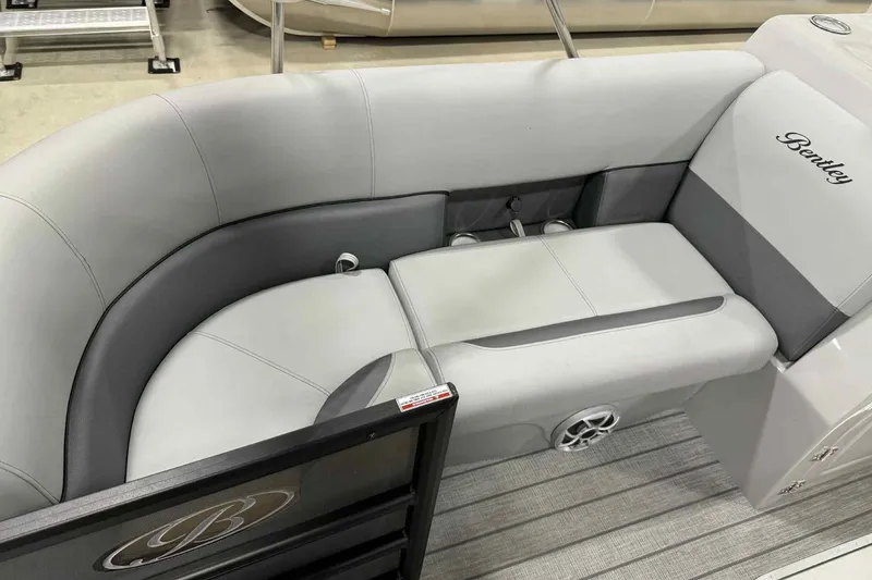 Slide: The Image of 2026 Bentley Pontoons Legacy 243 Swingback interior with plush seating and elegant design. - 8