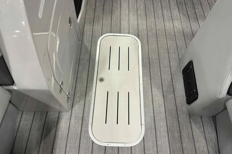 Slide: The Image of 2026 Bentley Pontoons Legacy 243 interior flooring with sleek design and storage compartment. - 9