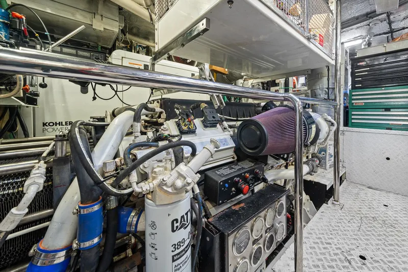 Slide: The Image of Engine room of a 2008 Sunseeker 90 Yacht, featuring Kohler power system and CAT components. - 110