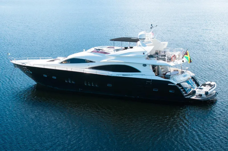 Slide: The Image of 2008 Sunseeker 90 Yacht on calm water, featuring sleek design and luxury amenities. - 14