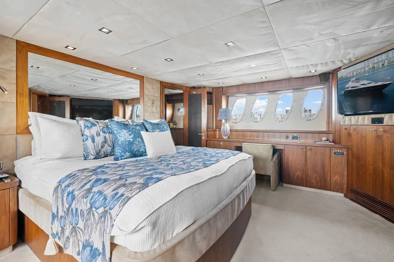 Slide: The Image of Luxurious bedroom interior of 2008 Sunseeker 90 Yacht with elegant wood finishes and ocean view. - 27
