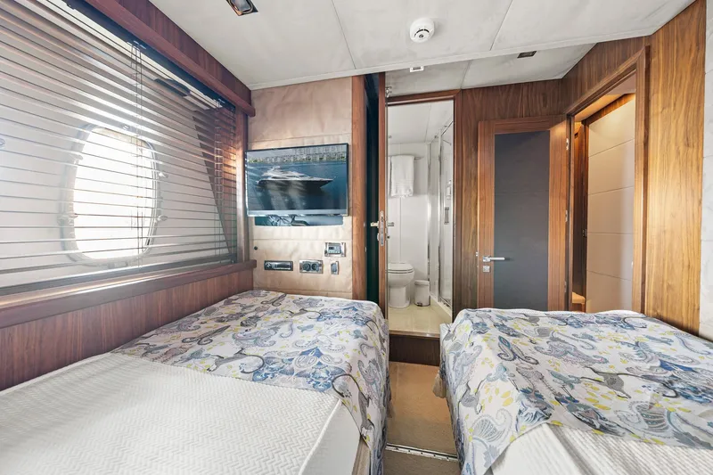 Slide: The Image of Interior of 2008 Sunseeker 90 Yacht cabin with twin beds and ensuite bathroom. - 30