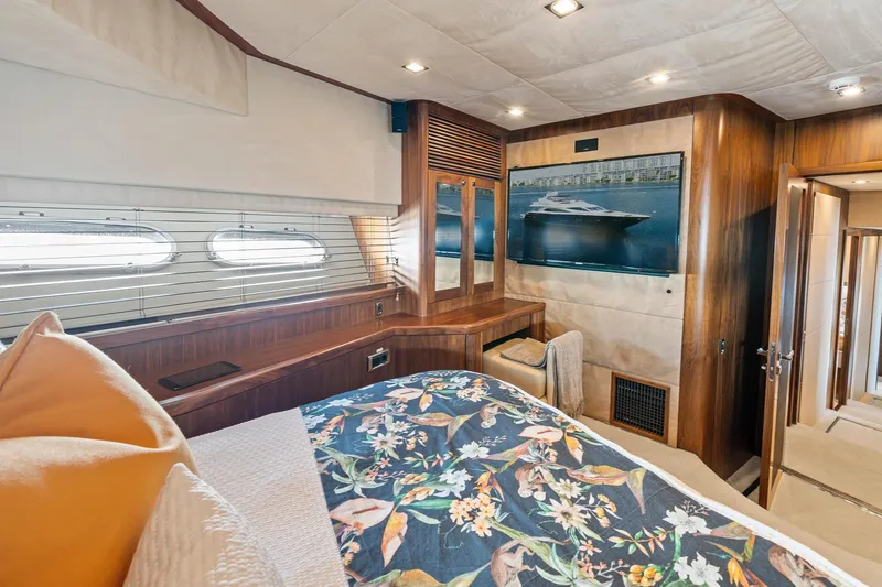Slide: The Image of Luxurious 2008 Sunseeker 90 Yacht bedroom with floral bedding and elegant wood finishes. - 33