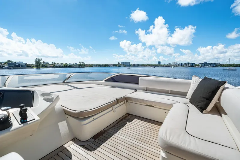 Slide: The Image of Luxurious 2008 Sunseeker 90 Yacht deck with plush seating, overlooking serene waters and skyline. - 36