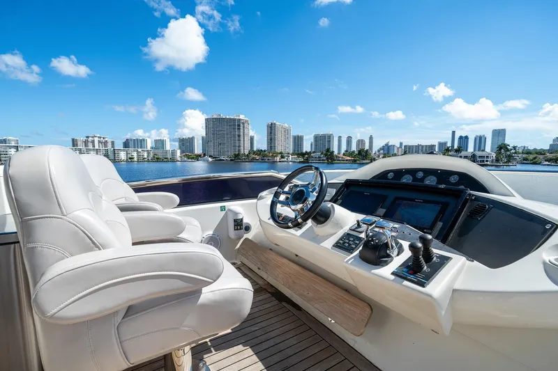 Slide: The Image of Luxurious 2008 Sunseeker 90 Yacht helm with city skyline view. - 37