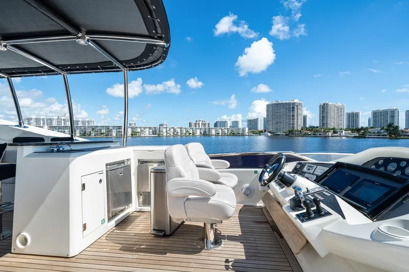 Slide: The Image of Luxurious 2008 Sunseeker 90 Yacht helm with city skyline view. - 38