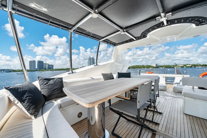Slide: The Image of Luxurious 2008 Sunseeker 90 Yacht deck with seating, table, and scenic waterfront view. - 39
