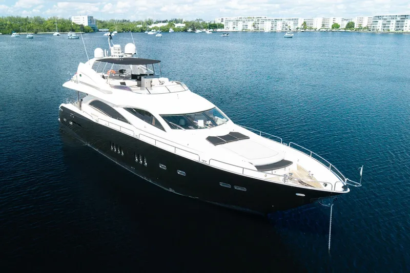 Slide: The Image of Luxurious 2008 Sunseeker 90 Yacht cruising on serene waters. - 4