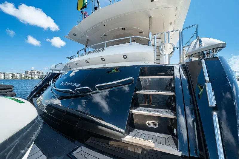 Slide: The Image of Luxury Sunseeker 90 Yacht, 2008 model, docked with sleek black exterior and elegant design. - 55