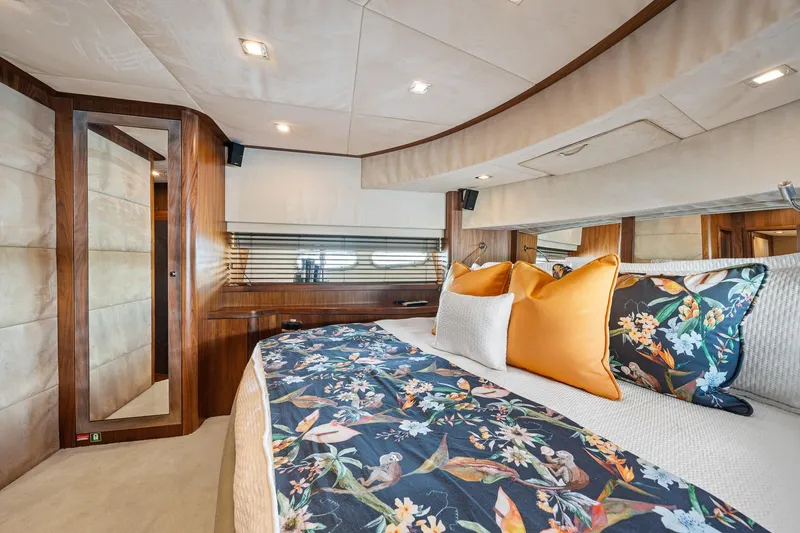 Slide: The Image of Luxurious bedroom interior of 2008 Sunseeker 90 Yacht with floral bedding and elegant wood finishes. - 62