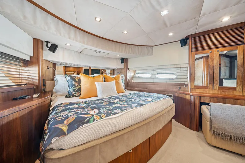 Slide: The Image of Luxurious bedroom interior of 2008 Sunseeker 90 Yacht with elegant wood finishes and plush bedding. - 63