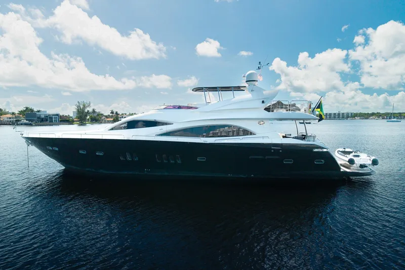 Slide: The Image of 2008 Sunseeker 90 Yacht on calm water under a clear blue sky. - 7