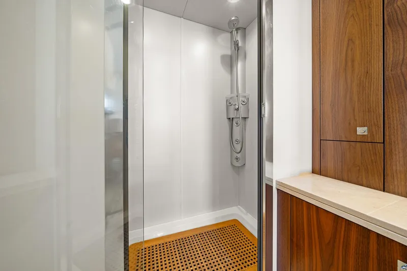 Slide: The Image of Shower area in 2008 Sunseeker 90 Yacht with wooden accents and modern fixtures. - 70