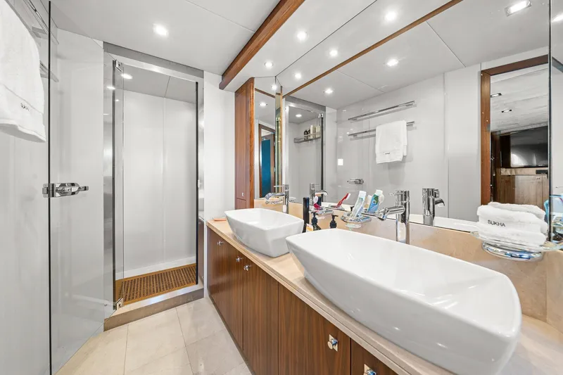 Slide: The Image of Luxurious bathroom on a 2008 Sunseeker 90 Yacht with dual sinks and modern shower. - 71