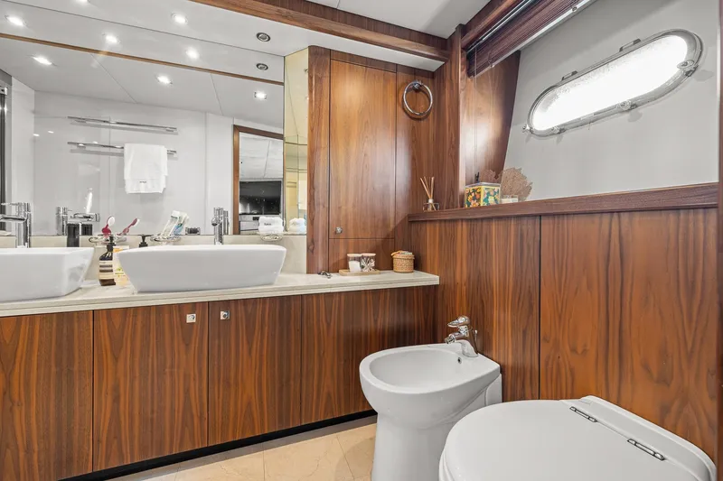 Slide: The Image of Luxurious bathroom on 2008 Sunseeker 90 Yacht with wood paneling and modern fixtures. - 72