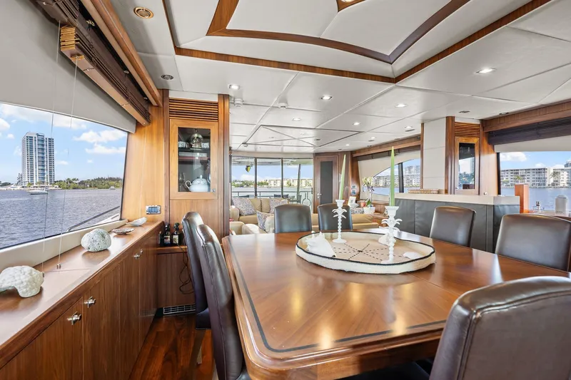 Slide: The Image of Luxurious interior of 2008 Sunseeker 90 Yacht with elegant dining area and waterfront view. - 90
