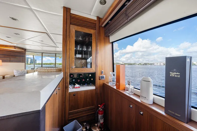 Slide: The Image of Luxurious interior of 2008 Sunseeker 90 Yacht with bar and scenic water view. - 94