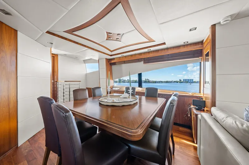 Slide: The Image of Luxurious interior of 2008 Sunseeker 90 Yacht with elegant dining area and scenic window view. - 95