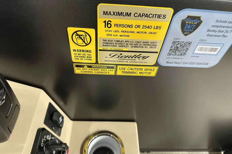 Slide: The Image of 2026 Bentley Pontoons Legacy 243 Swingback capacity and safety labels with QR code. - 13
