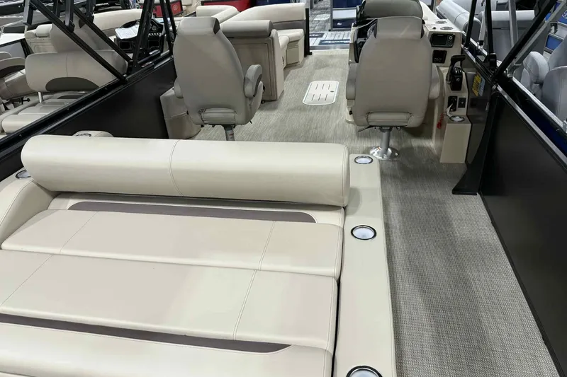 Slide: The Image of 2026 Bentley Pontoons Legacy 243 interior with dual captain seats and swingback lounge. - 15