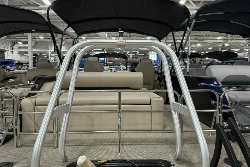 Slide: The Image of 2026 Bentley Pontoons Legacy 243 Swingback Dual Captain 3/4 Tube interior with seating and railings. - 16