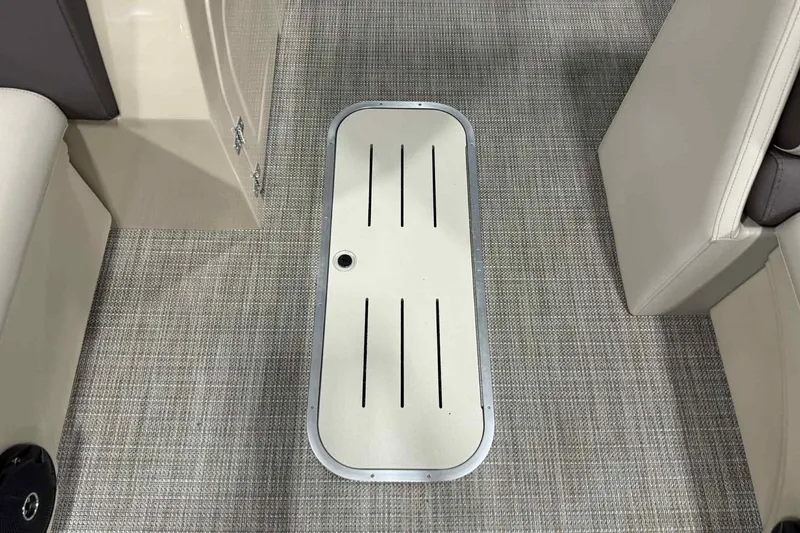 Slide: The Image of 2026 Bentley Pontoons Legacy 243 interior flooring with storage compartment. - 3