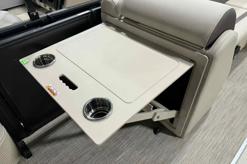Slide: The Image of 2026 Bentley Pontoons Legacy 243 Swingback interior with foldable table and cup holders. - 5