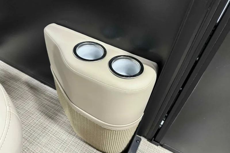 Slide: The Image of Cup holders in Bentley Pontoons Legacy 243 Swingback, 2026 model, with beige upholstery. - 7